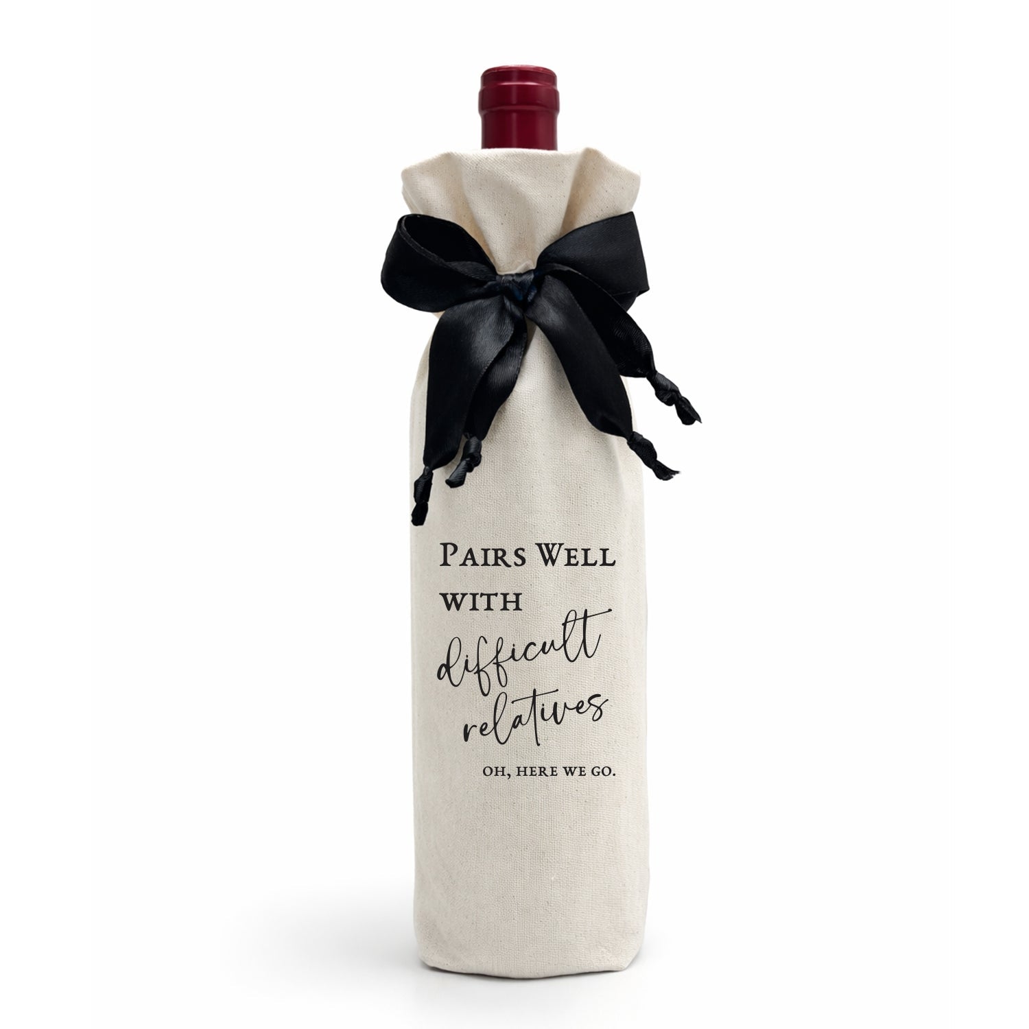 Wine bottle wrapped in a calico cotton gift bag, luxe satin ribbon with black text on a white background, Pairs Well With Difficult Relatives.